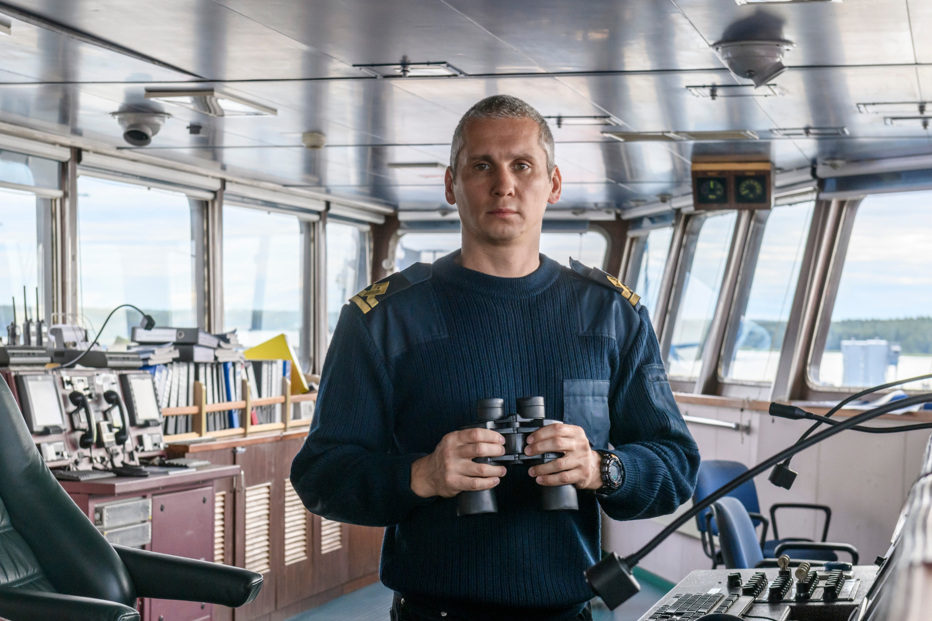 On-Scene-Coordinator trained by Visiomare.com - Deck,Officer,With,Binoculars,On,Navigational,Bridge.,Seaman,On,Board